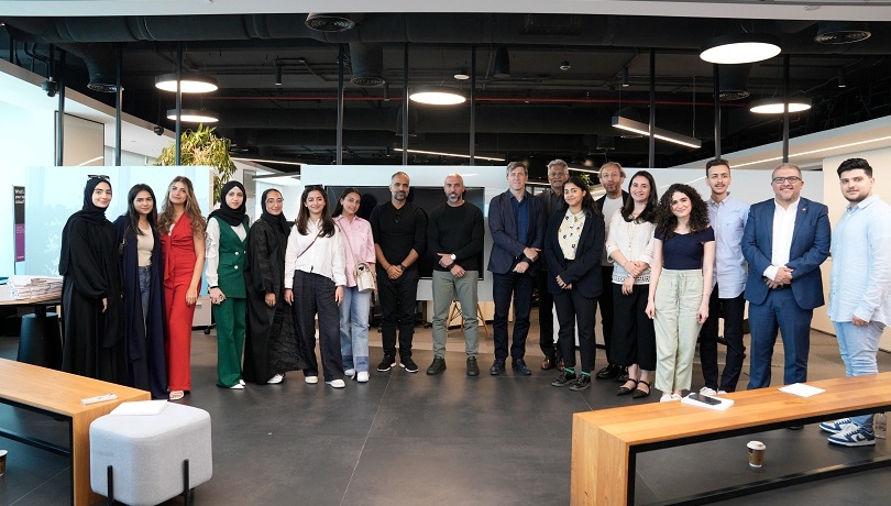 Arada senior staff and faculty from AUS join the students for a group photo at Arada HQ