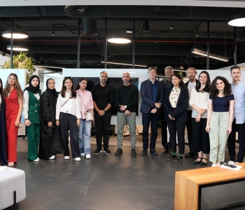 Arada senior staff and faculty from AUS join the students for a group photo at Arada HQ